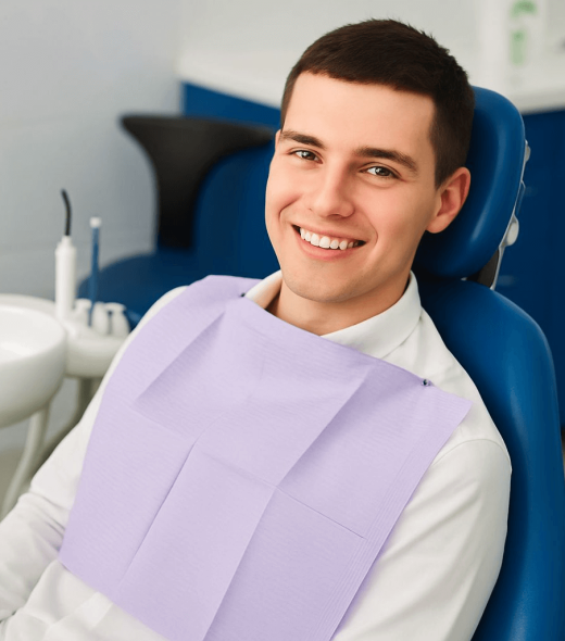 Man Smiling Comfortably In Dental Chair With Clinic Background